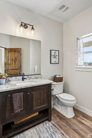 3311 West Allard Summit, UT 84772 - Photo 33 of 97 Bathroom featuring a dark wood-finish vanity with a granite countertop, undermount sink, and black faucet