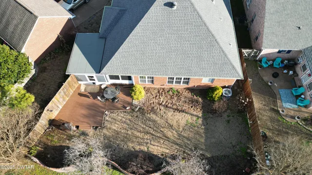 a aerial view of a house with a yard