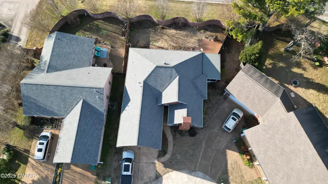 an aerial view of houses with outdoor space