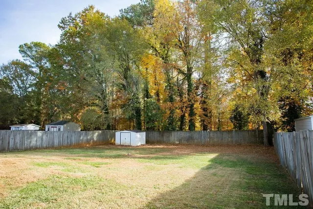 a view of swimming pool with a yard