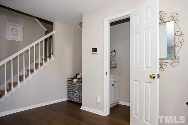 a view of an entryway with wooden floor