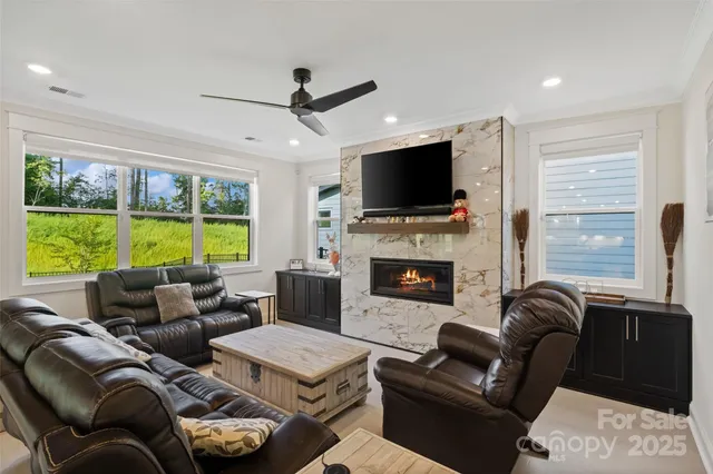 a living room with furniture and a large window