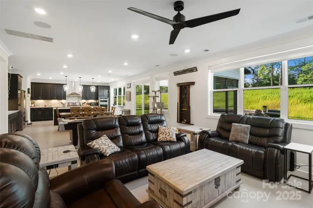 a room with furniture and flat screen tv