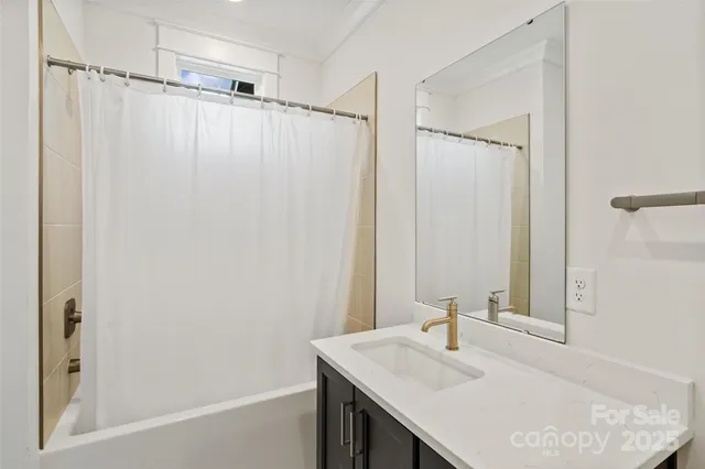 a view of living room with furniture and flat screen tv