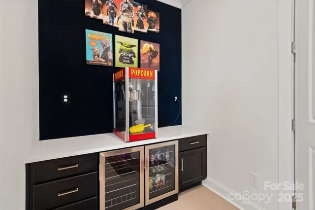 a media room with lots of chairs and a projector screen