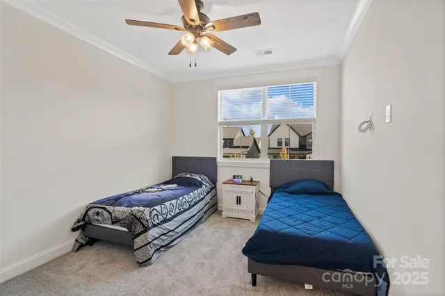 a bedroom with a bed and a flat tv screen