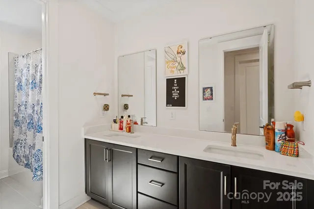 a room with a large window and furniture