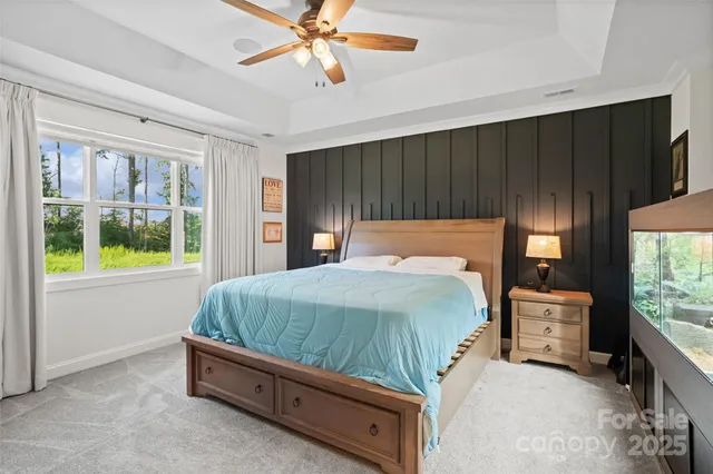 a bathroom with a tub double vanity window and sink