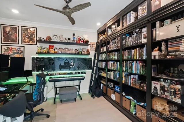 a view of a workspace with furniture and a workspace