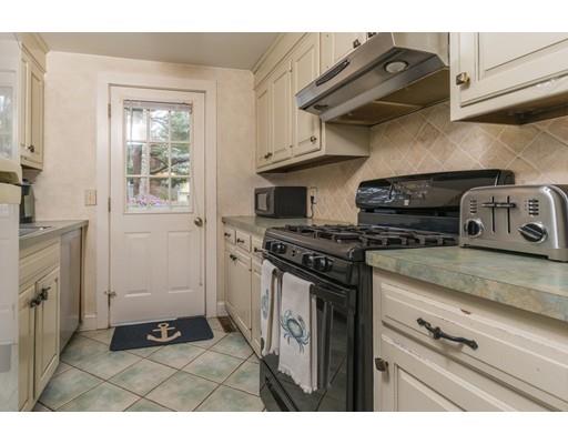 98 Cap'n Lijah's Road Barnstable, MA 02632 - Photo 3 of 9 a kitchen with stainless steel appliances granite countertop a stove and a refrigerator