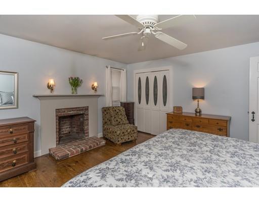 98 Cap'n Lijah's Road Barnstable, MA 02632 - Photo 7 of 9 a living room with furniture and a fireplace