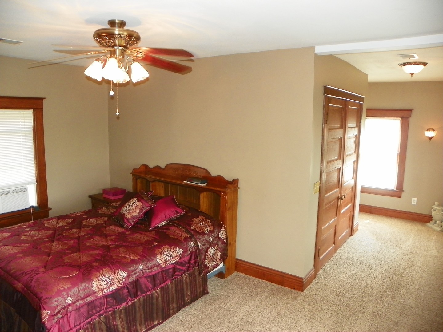 1780 Higgins Road Morris, IL 60450 - Photo 9 of 30 a bedroom with a bed and a chandelier