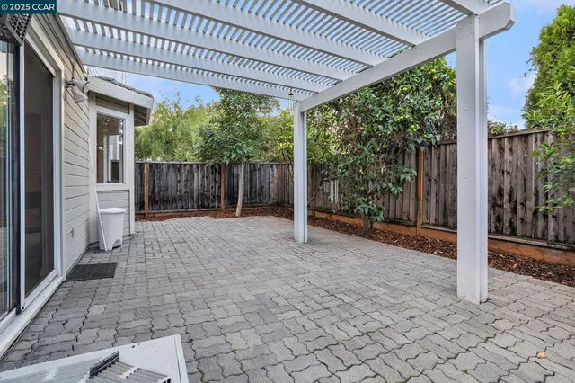 a view of a house with backyard and a porch