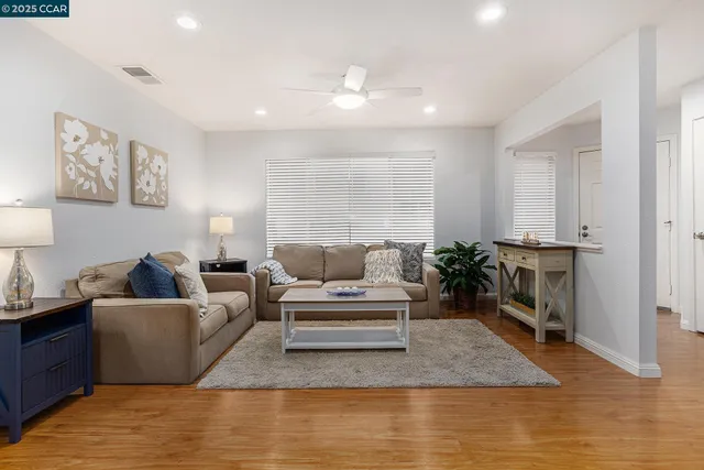 a living room with furniture and a table