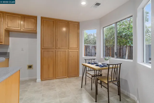 a table and chairs in a room with a door