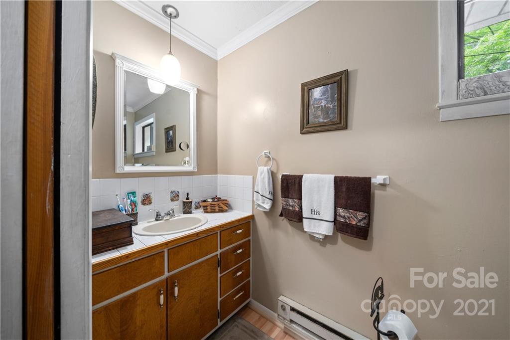 165 Nottingham Road Maggie Valley, NC 28751 - Photo 15 of 29 a bathroom with a sink and a mirror
