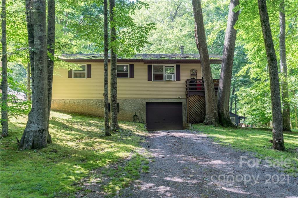 165 Nottingham Road Maggie Valley, NC 28751 - Photo 21 of 29 a view of a house with backyard and a tree