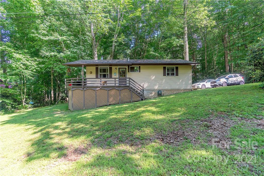 165 Nottingham Road Maggie Valley, NC 28751 - Photo 26 of 29 a front view of a house with garden