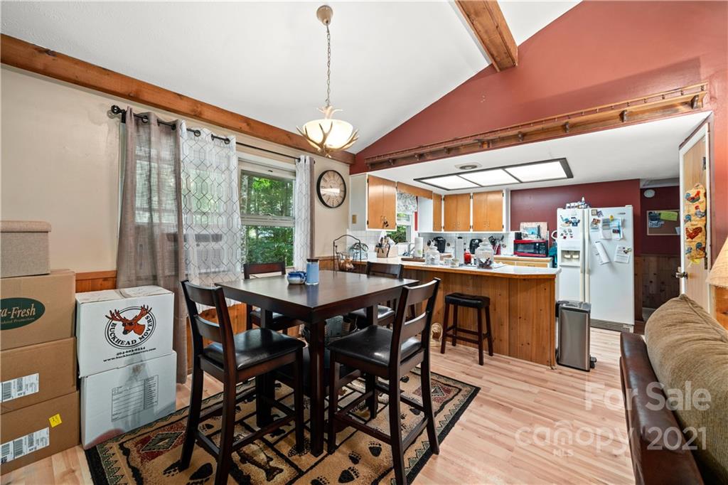 165 Nottingham Road Maggie Valley, NC 28751 - Photo 5 of 29 a view of a dining room with furniture window and wooden floor