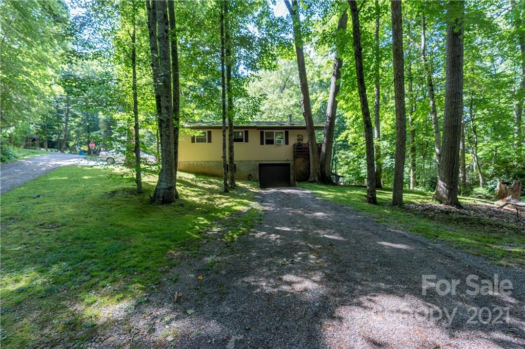 165 Nottingham Road Maggie Valley, NC 28751 - Photo 9 of 29 a view of a house with a yard