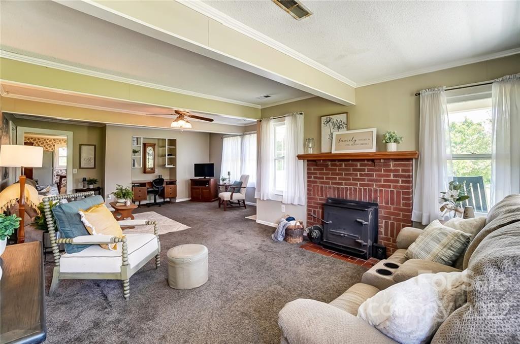 715 Clontz Long Road Monroe, NC 28110 - Photo 11 of 34 a living room with furniture and a fireplace