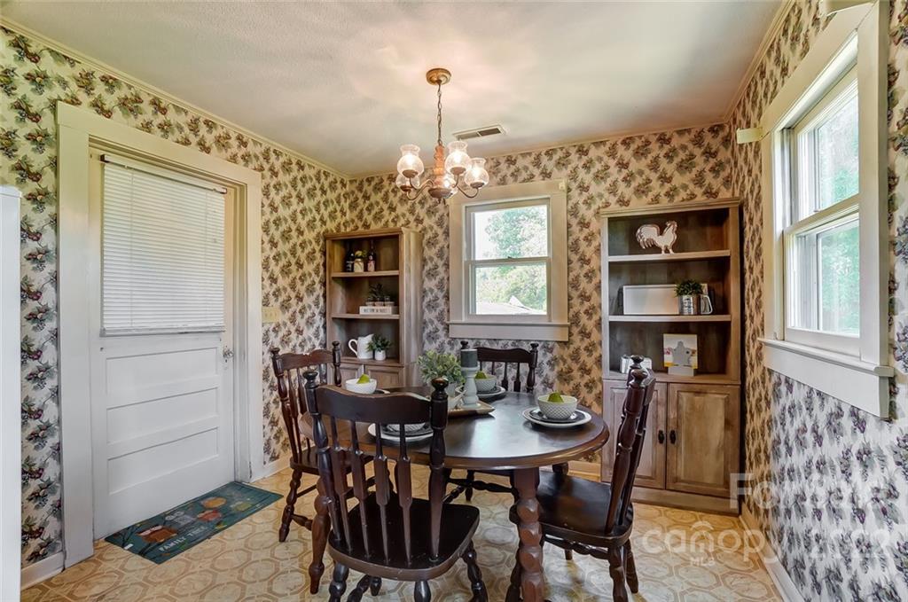 715 Clontz Long Road Monroe, NC 28110 - Photo 18 of 34 a view of a dining room with furniture and window