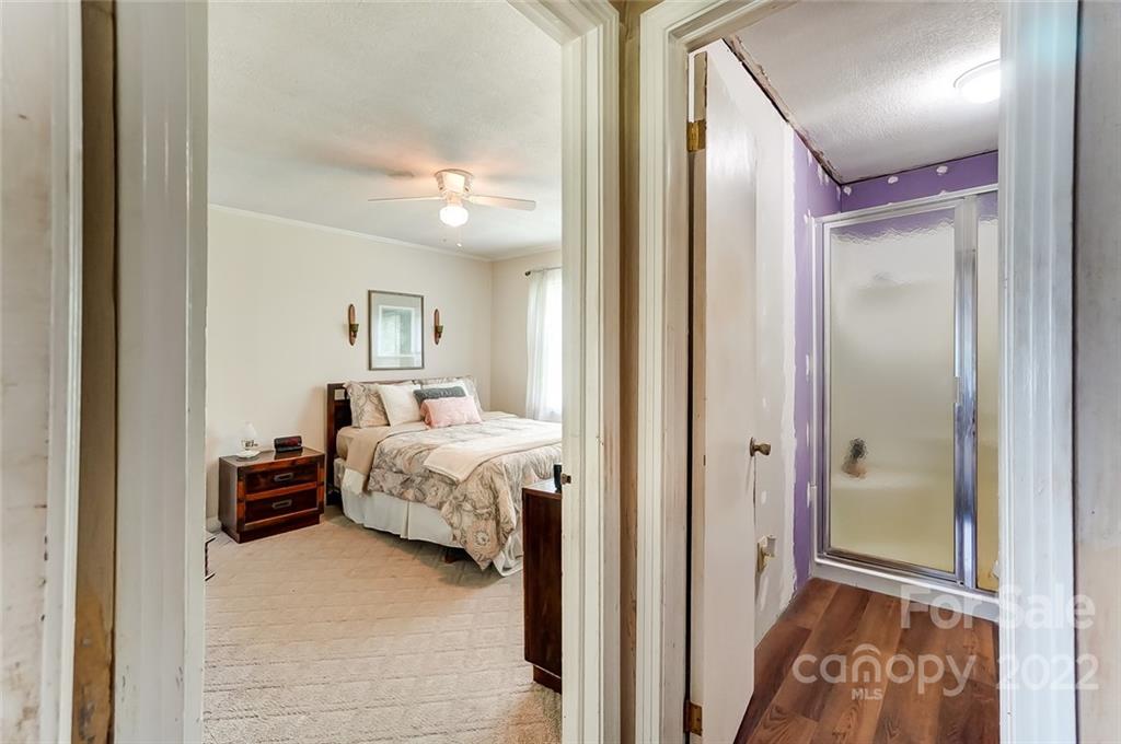 715 Clontz Long Road Monroe, NC 28110 - Photo 20 of 34 a bedroom with a bed and a mirror