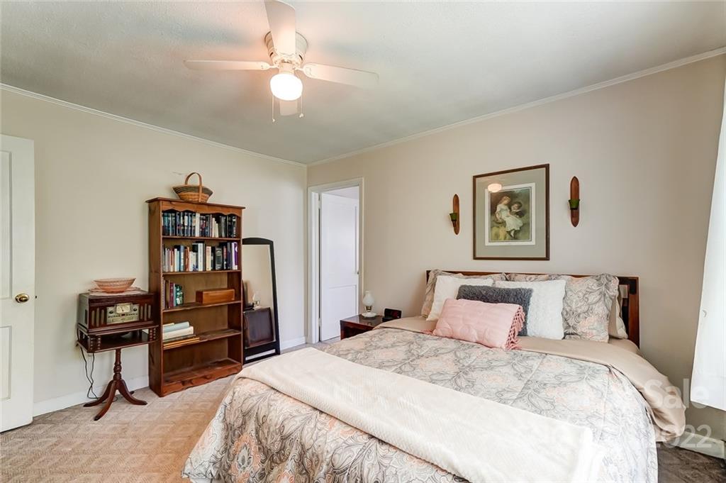 715 Clontz Long Road Monroe, NC 28110 - Photo 22 of 34 a bedroom with a bed and a book shelf