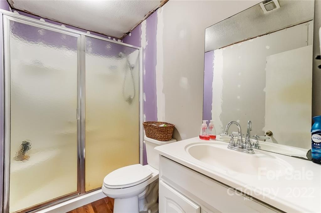 715 Clontz Long Road Monroe, NC 28110 - Photo 24 of 34 a bathroom with a sink toilet and shower