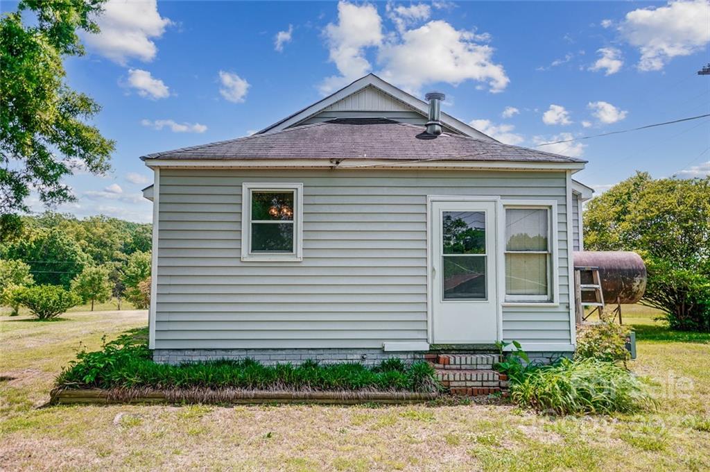 715 Clontz Long Road Monroe, NC 28110 - Photo 25 of 34 a front view of a house with garden