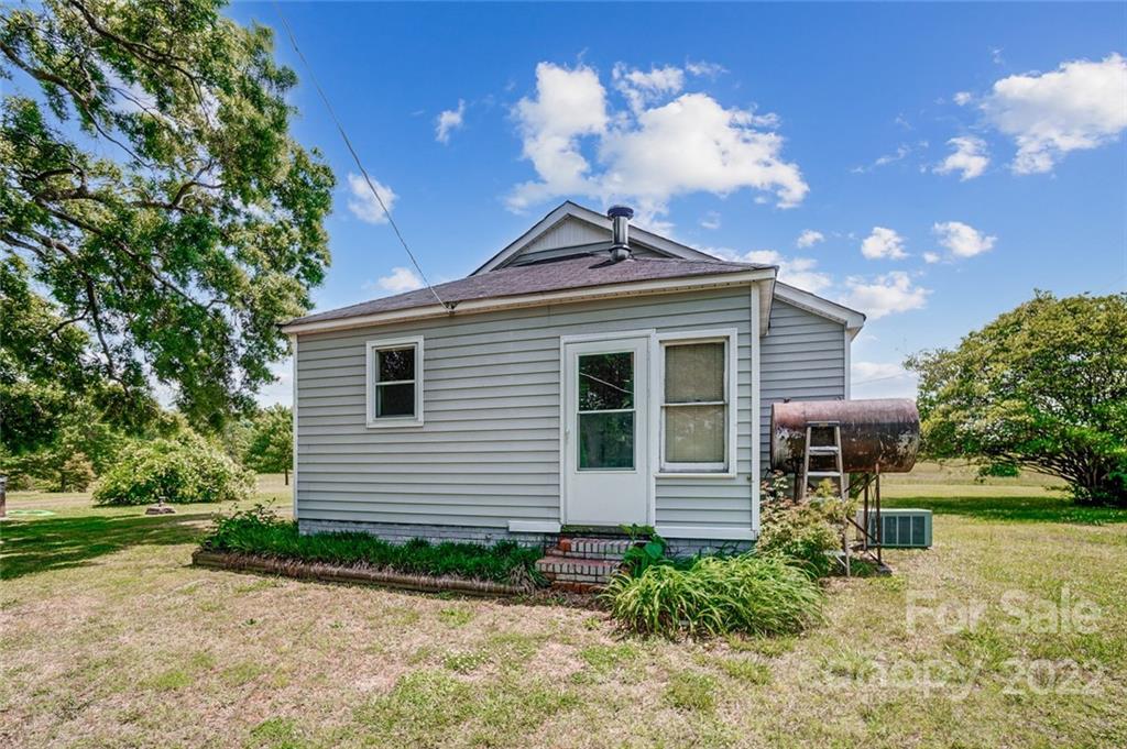 715 Clontz Long Road Monroe, NC 28110 - Photo 26 of 34 a front view of a house with a yard
