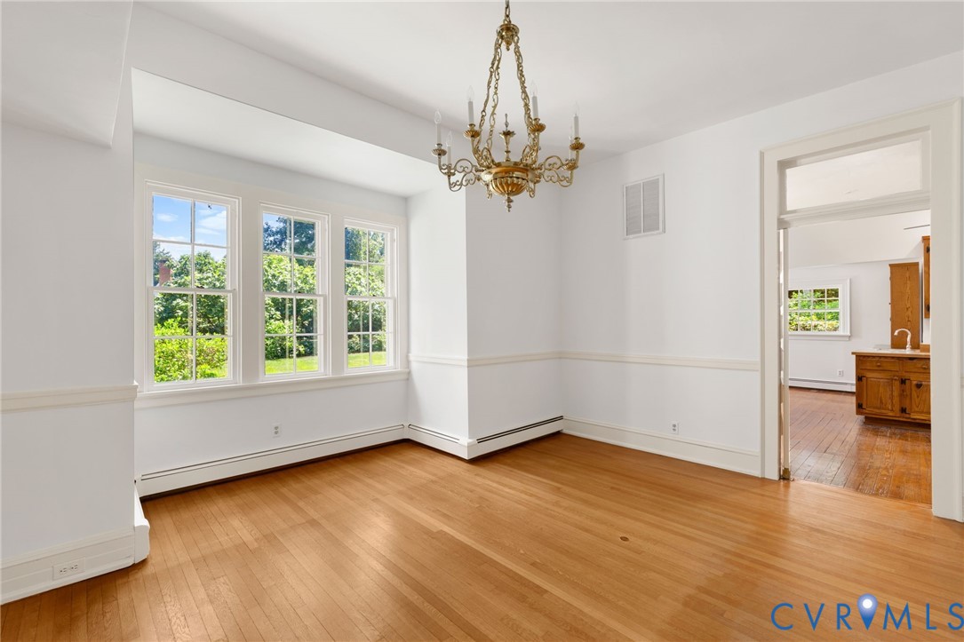 209 Ross Road Henrico, VA 23229 - Photo 15 of 43 Hardwood flooring, classic chandelier, and multipl