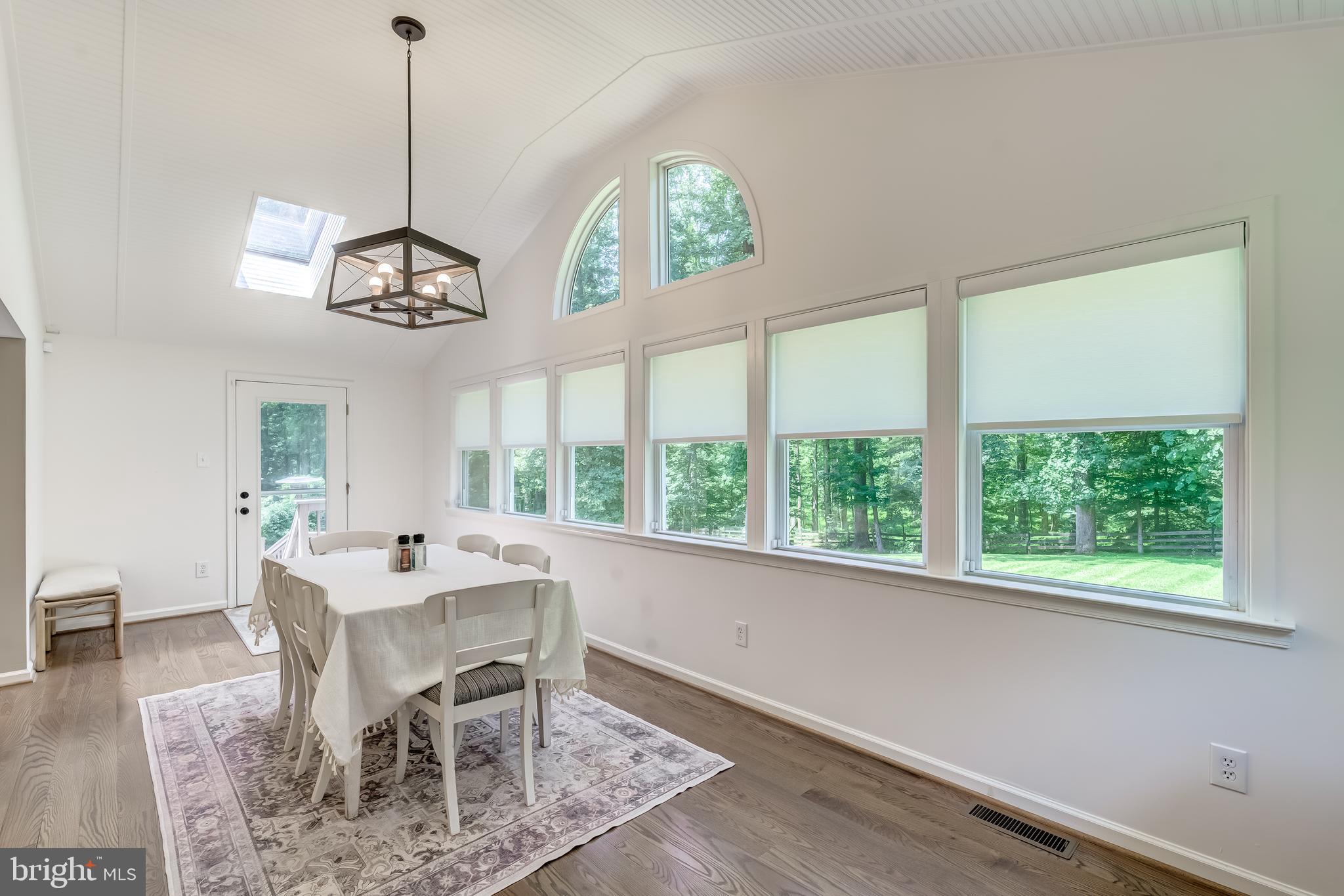 11926 Appling Valley Road Fairfax, VA 22030 - Photo 30 of 60 a view of a dining room with furniture window and wooden floor