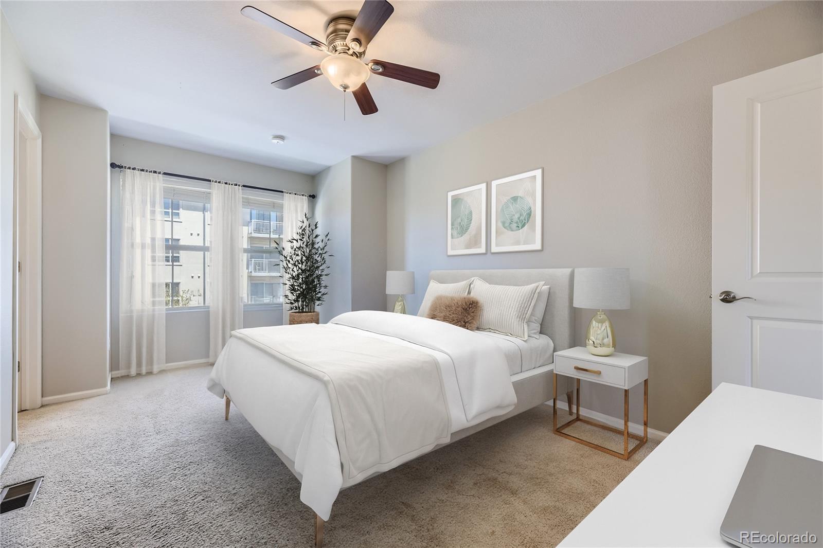 9494 Halstead Lane Lone Tree, CO 80124 - Photo 11 of 23 a bedroom with a large bed and a chandelier