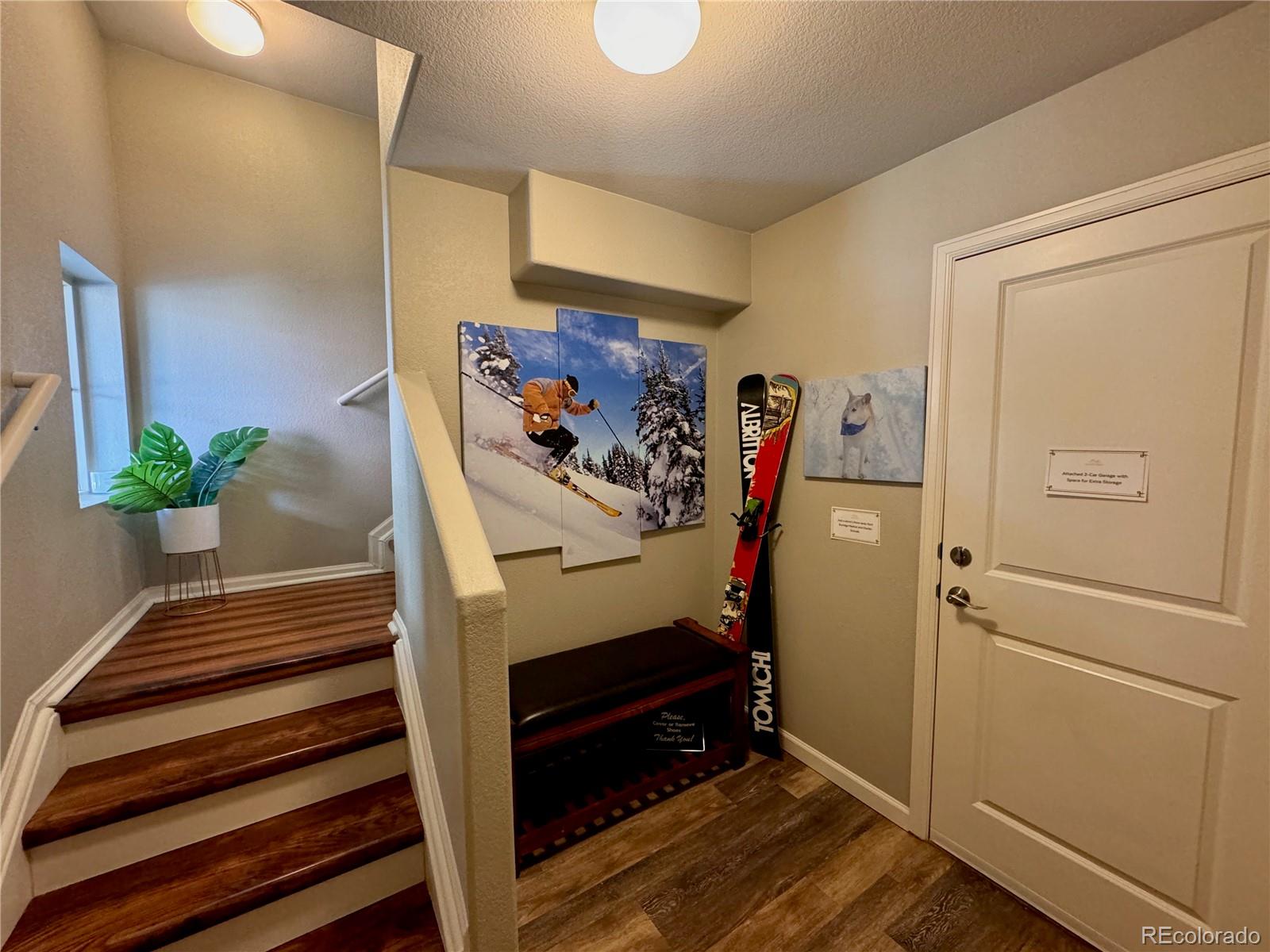 9494 Halstead Lane Lone Tree, CO 80124 - Photo 2 of 23 a view of entryway with stairs and wooden floor