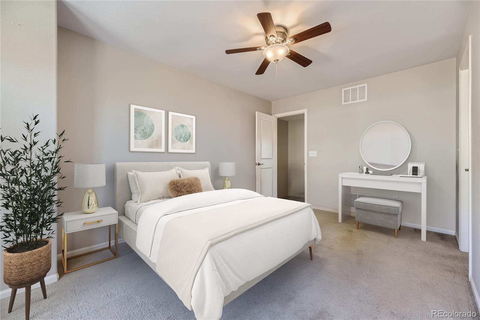 9494 Halstead Lane Lone Tree, CO 80124 - Photo 10 of 23 a bedroom with a large bed and a chandelier
