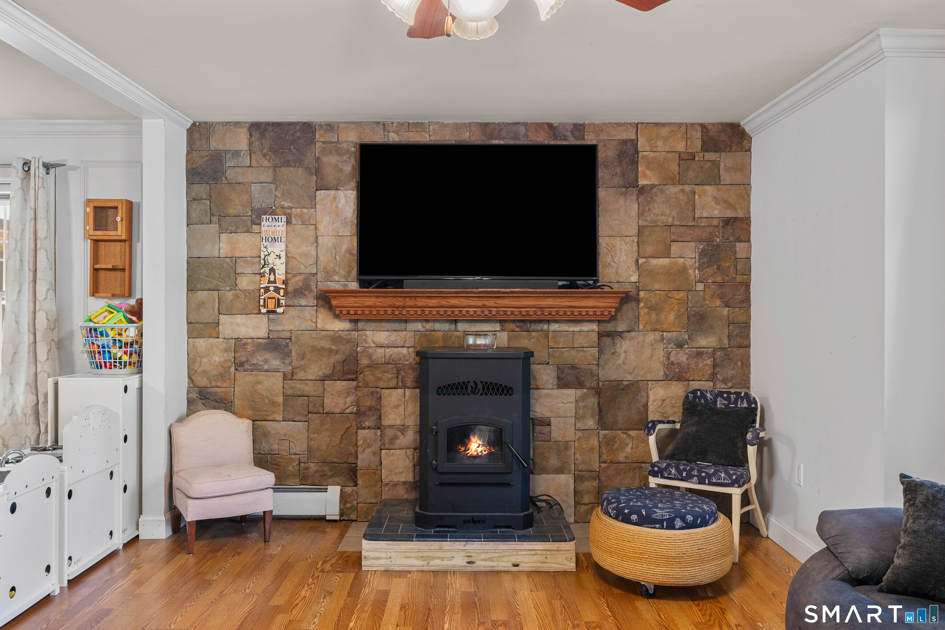 80 Sashel Lane Colchester, CT 06415 - Photo 17 of 37 Living room with cozy pellet stove