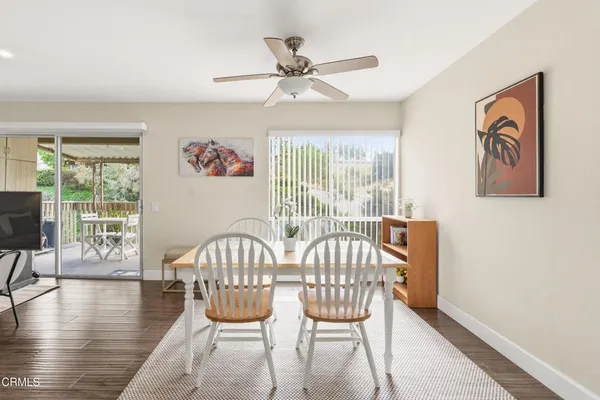 a view of a dining room with furniture window and wooden floor
