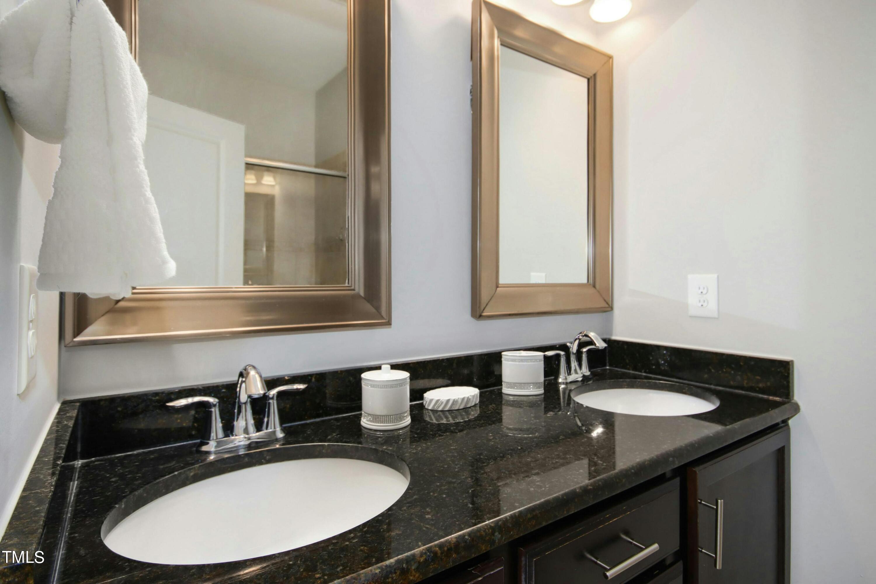 1418 Ardara Lane Raleigh, NC 27607 - Photo 21 of 34 a bathroom with double sink and a mirror