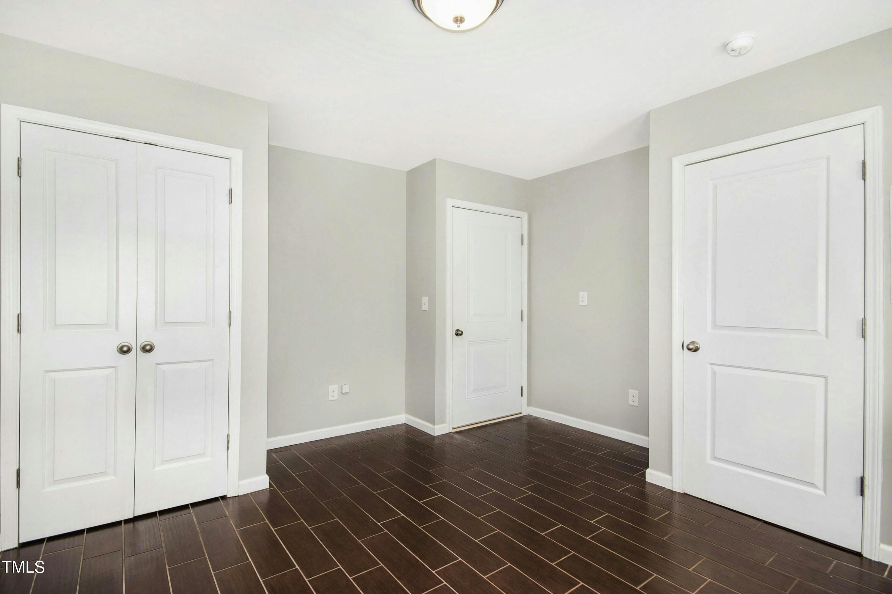 1418 Ardara Lane Raleigh, NC 27607 - Photo 5 of 34 a view of a livingroom with wooden floor and closet