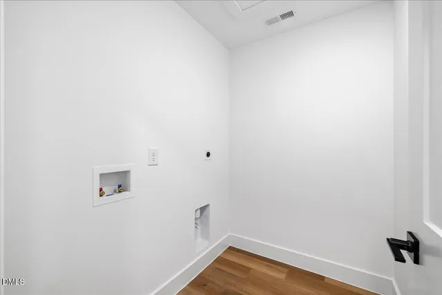 a view of a small space with wooden floor