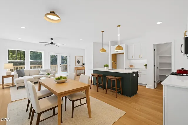a large kitchen with a table and chairs in it