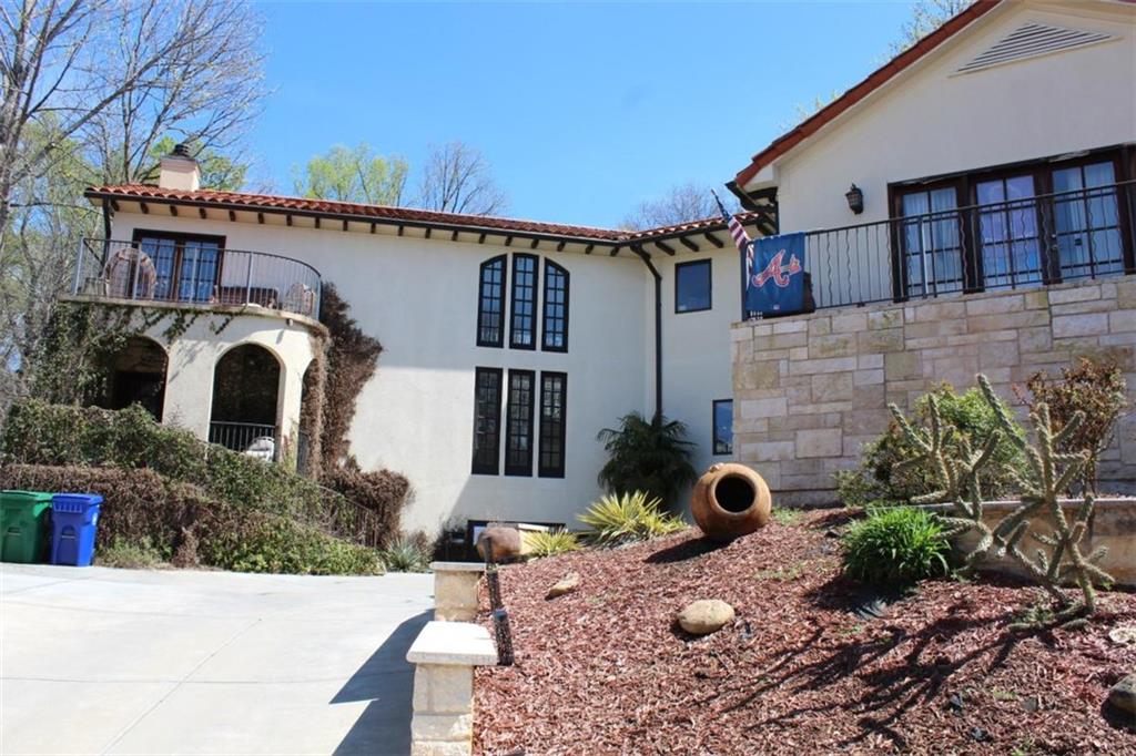 413 Spring House Cove Northeast Atlanta, GA 30307 - Photo 2 of 9 a view of a house with potted plants