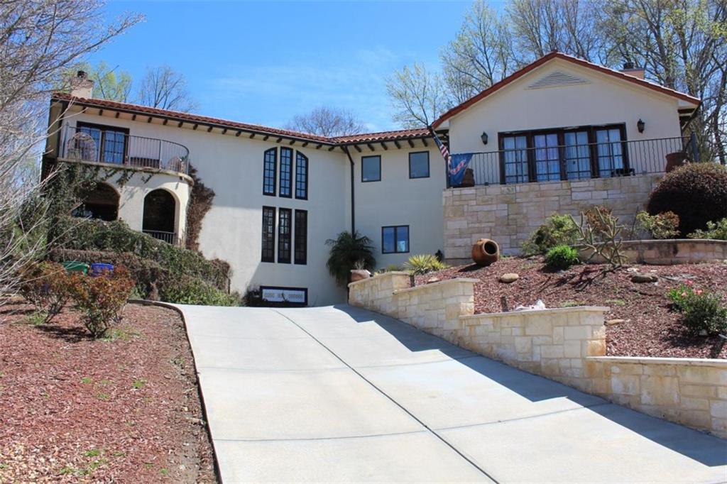 413 Spring House Cove Northeast Atlanta, GA 30307 - Photo 5 of 9 a front view of a house with garden