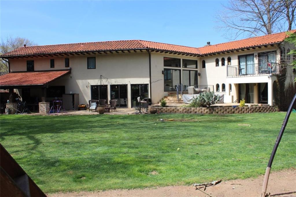 413 Spring House Cove Northeast Atlanta, GA 30307 - Photo 7 of 9 a front view of a house with a garden