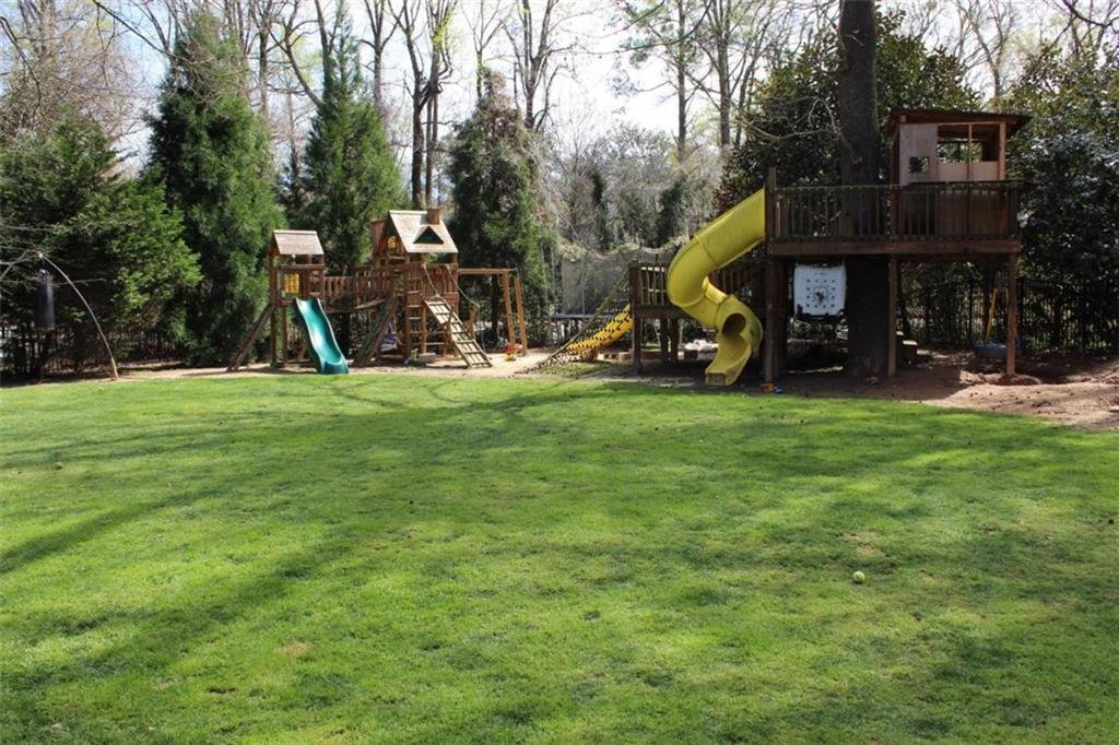 413 Spring House Cove Northeast Atlanta, GA 30307 - Photo 9 of 9 a view of a park with large trees and a park