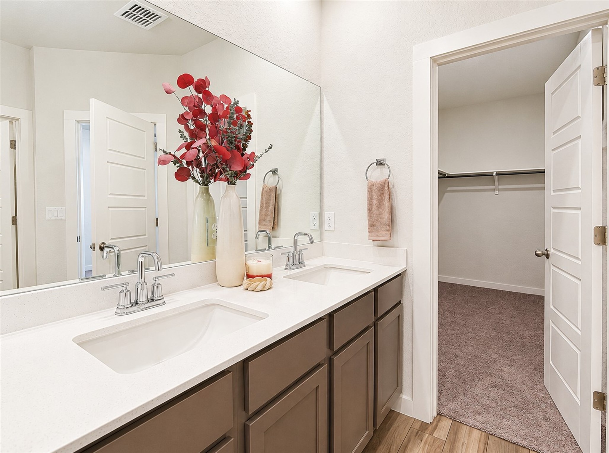 1924 Split Rock Road New Braunfels, TX 78130 - Photo 9 of 20 An adjacent walk-in closet sits just steps away from this dual vanity bathroom.