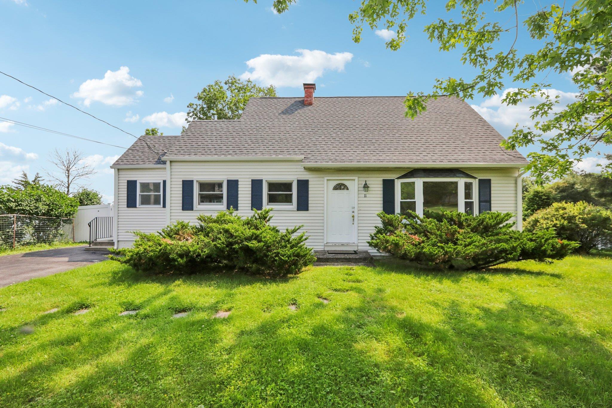 11 High Ridge Road Monroe, NY 10950 - Photo 1 of 1 Cape cod home with a gate, a chimney, and a shingled roof
