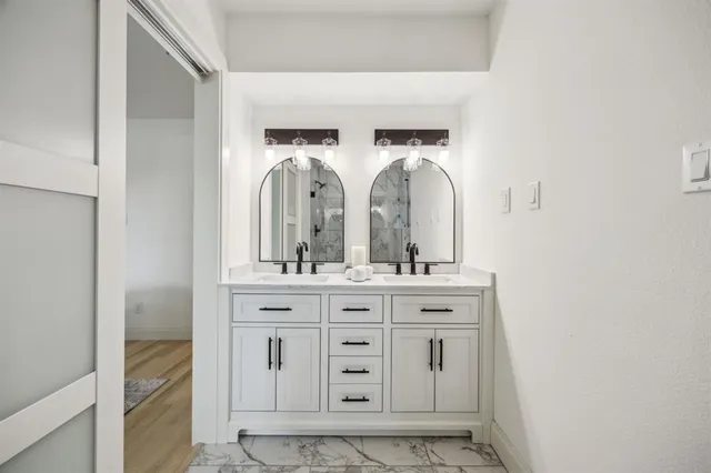 a bathroom with a toilet and shower