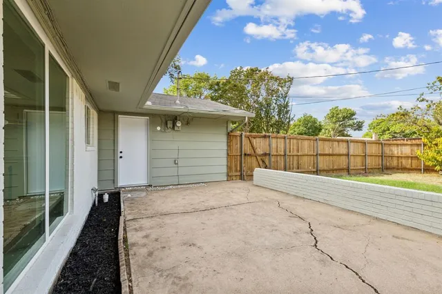 a view of a house with a tree